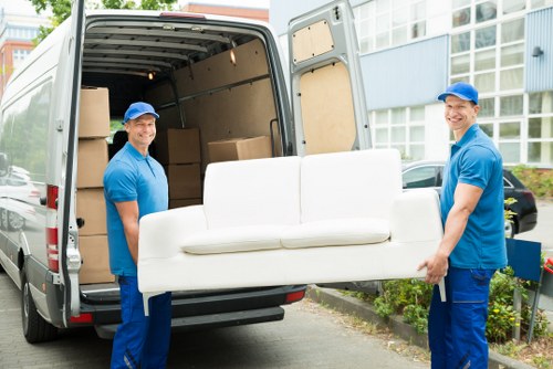 Moving van and packed household boxes on a residential street in Palmers Green