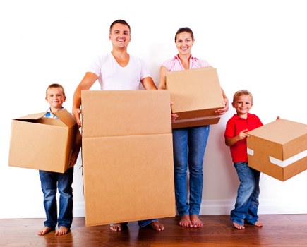 Local removal crew unloading boxes at a Palmers Green property