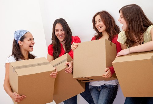 Careful loading of household items into a moving van