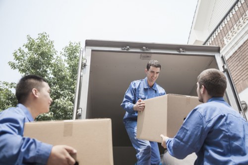 Family home moving scene with careful loading near Palmers Green