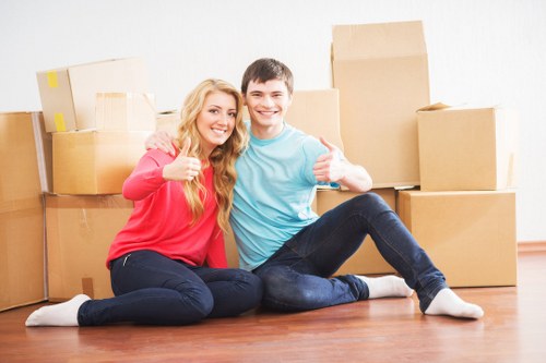Boxes and household items loaded into a van for transport