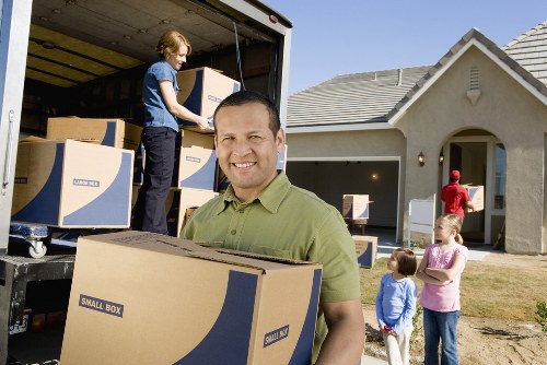 Packed moving boxes secured safely in a van