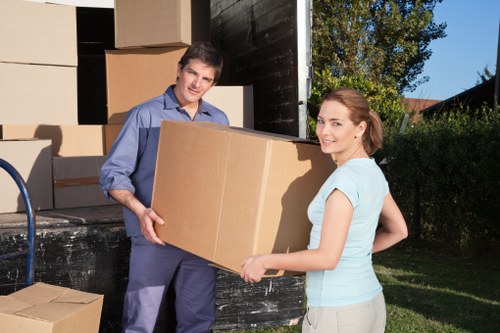 Professional office move team handling desks and files in Palmers Green