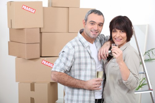 Packed office equipment and furniture ready for transport in North London